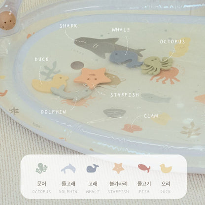Placemat with cartoon sea creatures and labels on a textured surface